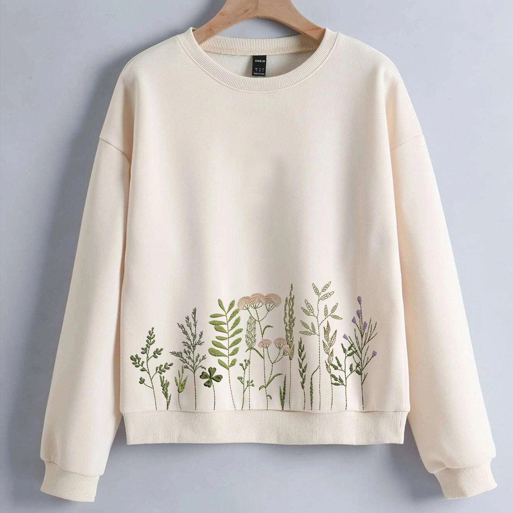 Meadow wildflower machine embroidery design set on blouse or sweat shirt