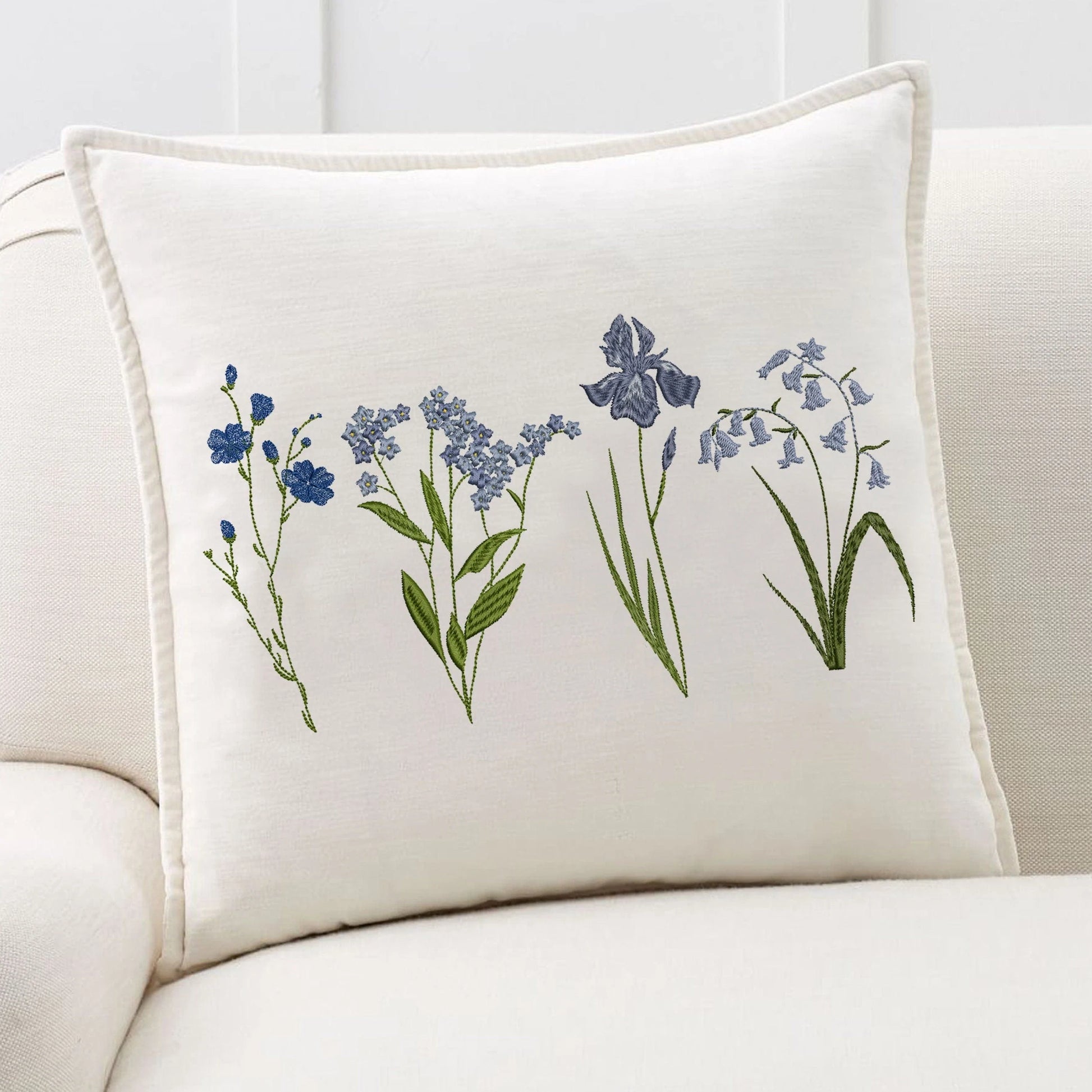 Blue wild flowers machine embroidery design on pillow