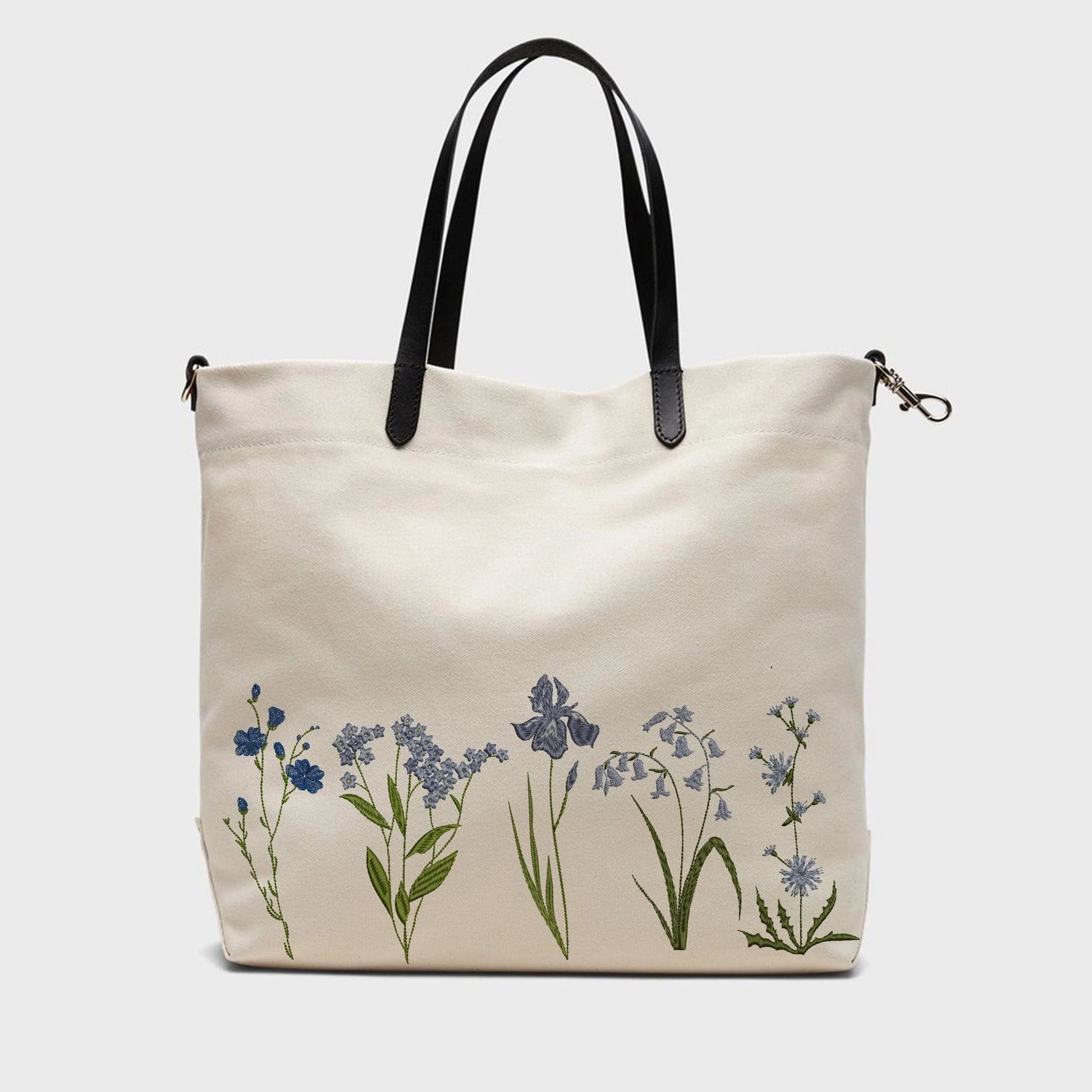 Blue wild flowers flax iris, cornflower forget-me-not machine embroidery designs on handbag