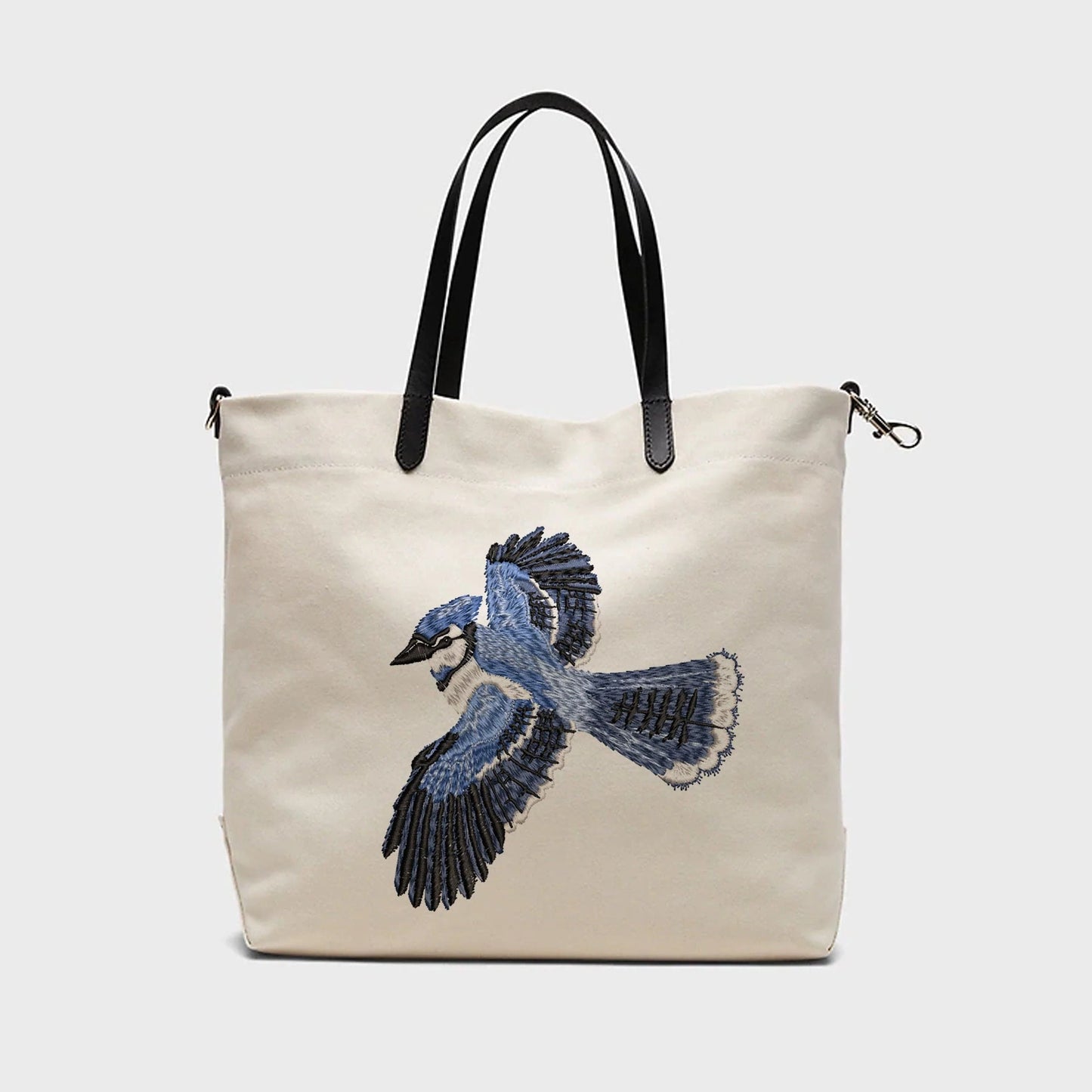 Beautiful Bluebird machine embroidery design on linen handbag