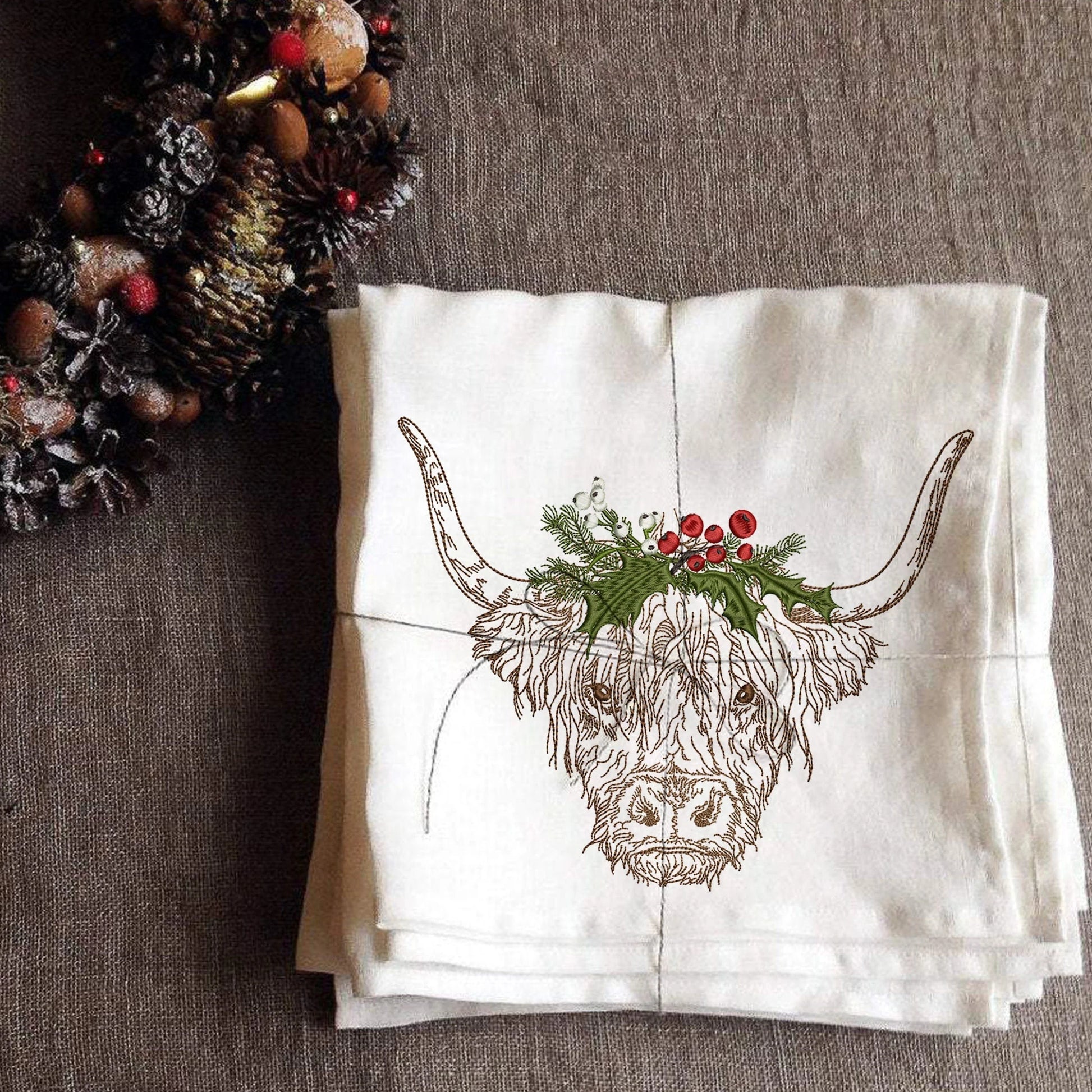 Christmas Highland Cow Machine Embroidery Design on napkin