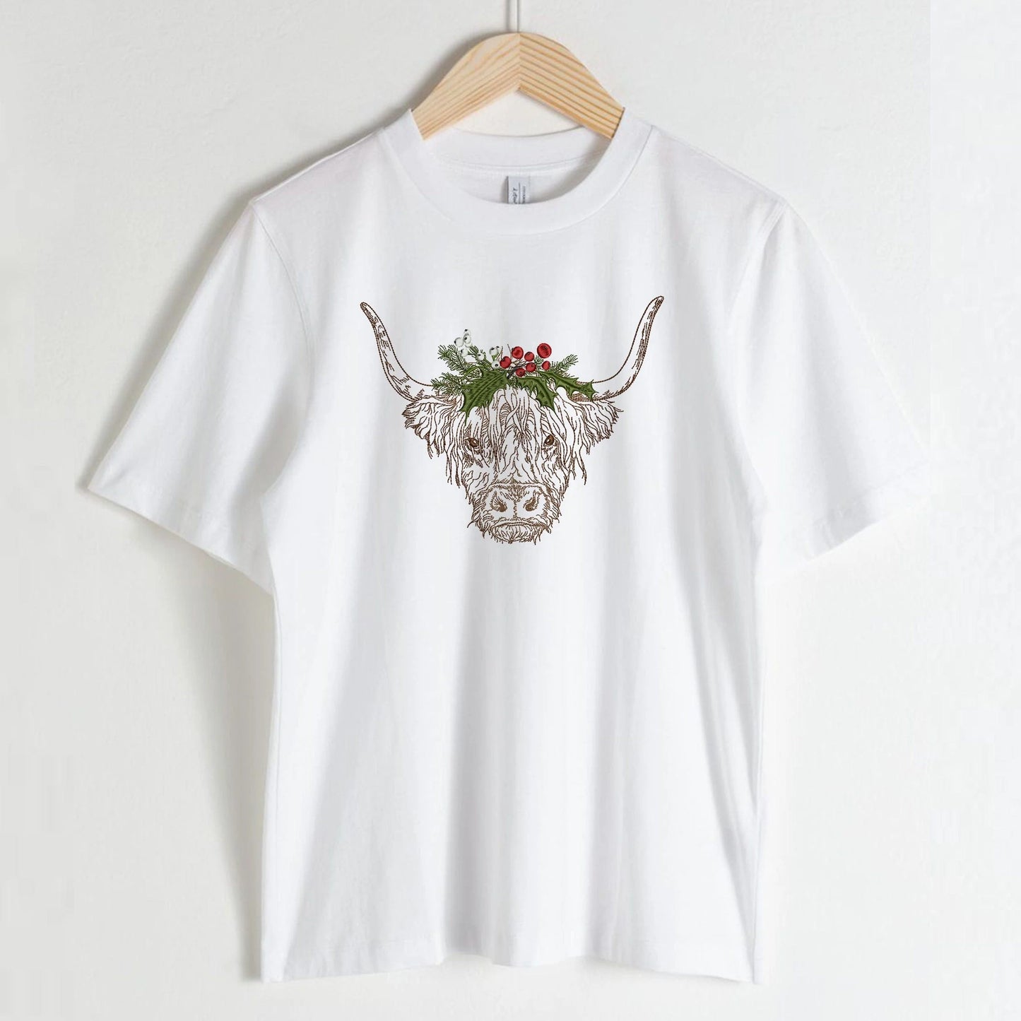 Christmas Highland Cow Machine Embroidery Design on t-shirt blouse