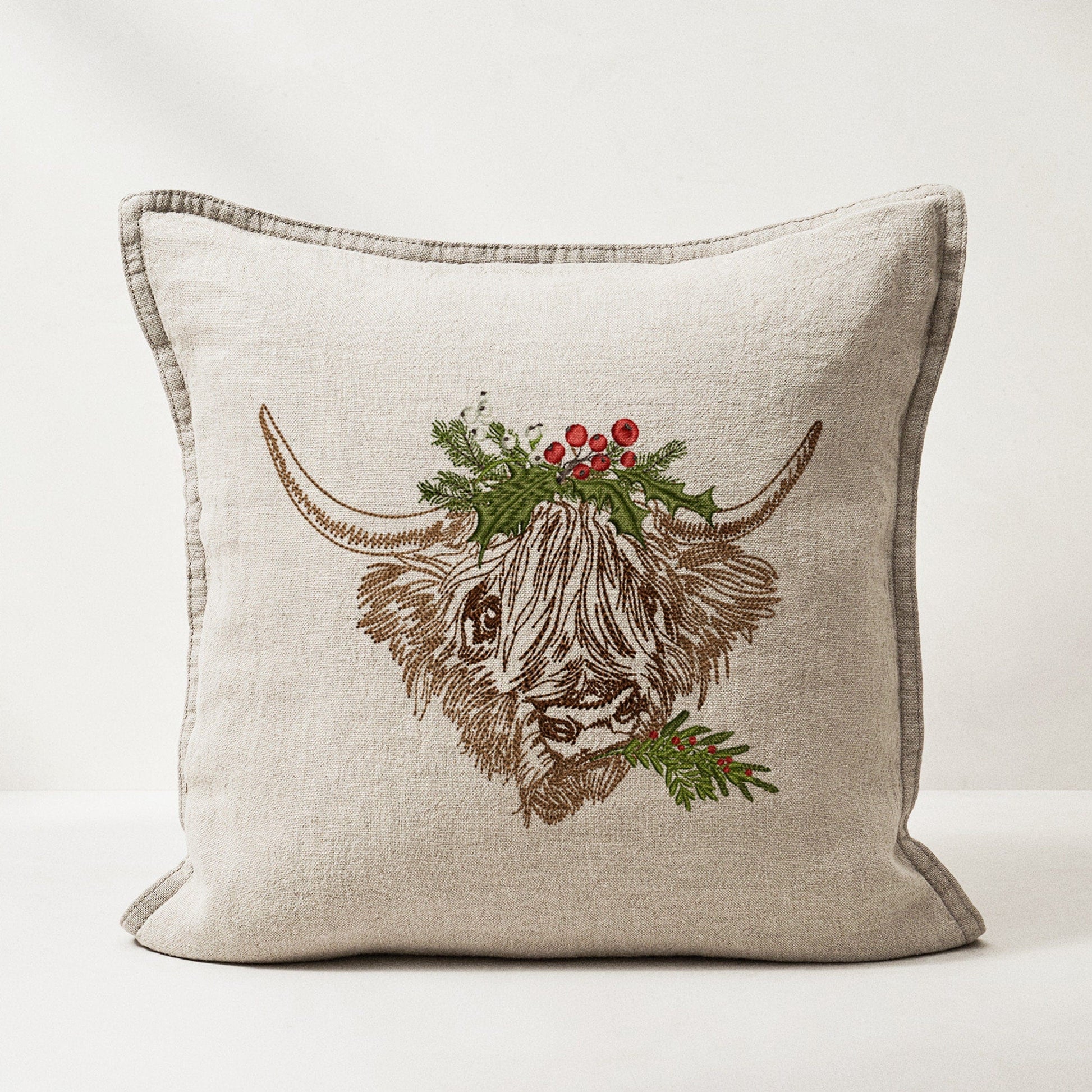 Christmas Highland Cow Machine Embroidery Design on linen pillow