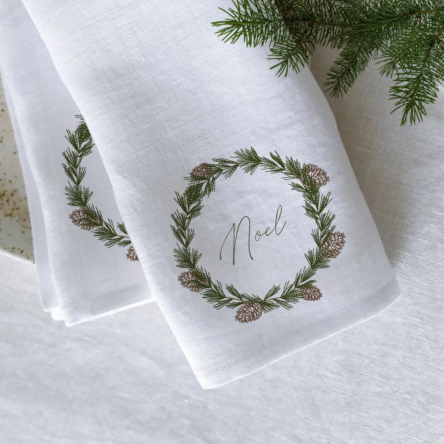 Christmas Pine Tree Monogram Wreath Machine Embroidery Design on table napkin