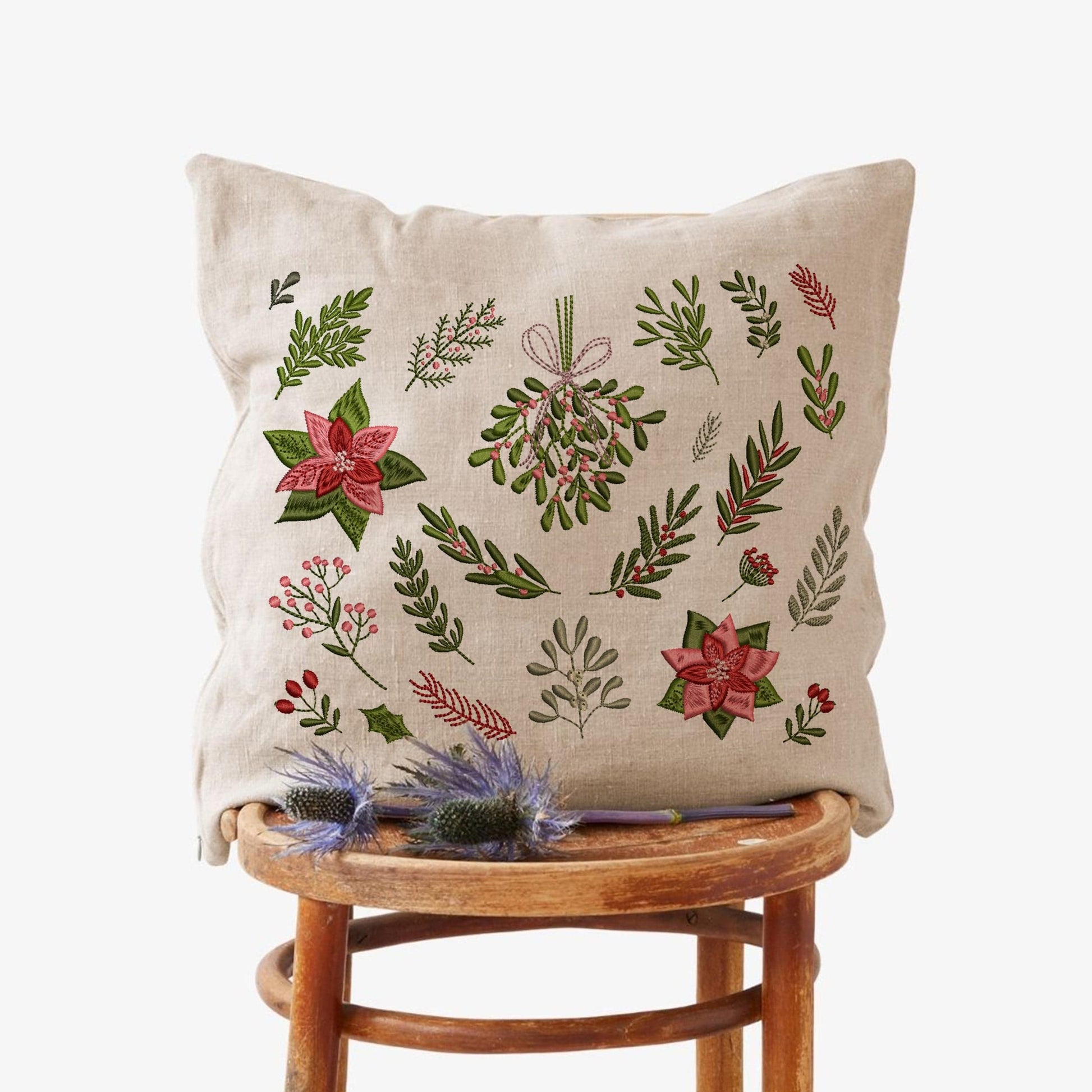 Christmas Poinsettia Machine Embroidery Design Bundle on pillow