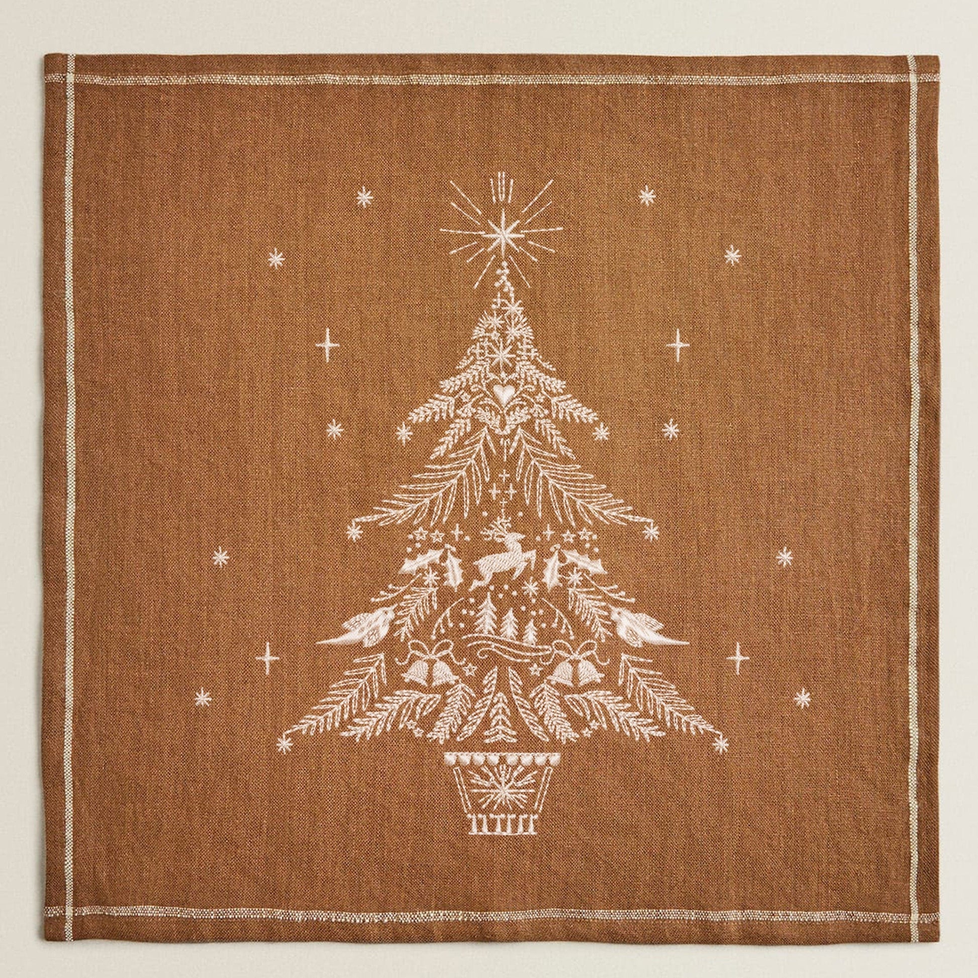 Magical Christmas Tree Machine Embroidery Design on table napkin