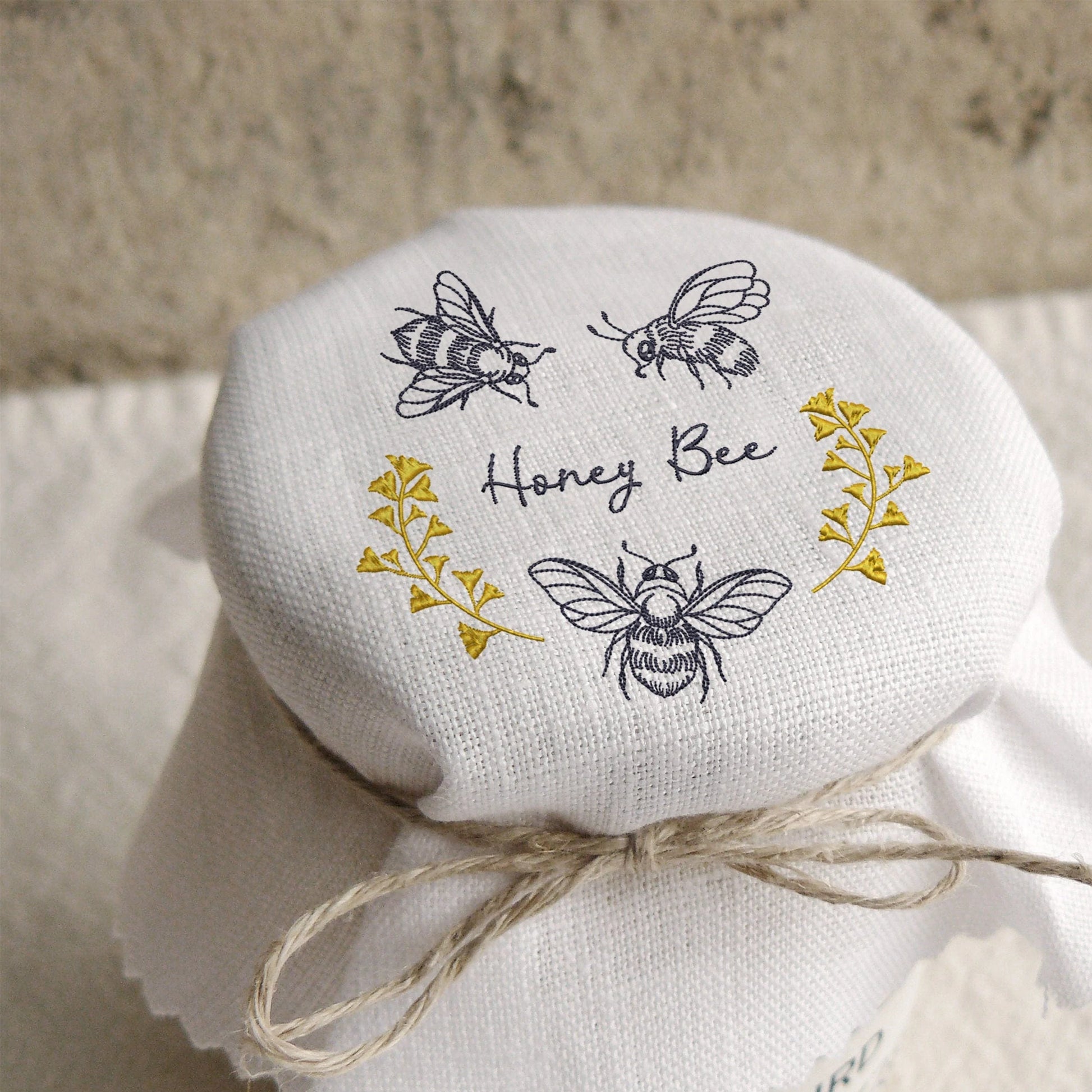 Honey Bee Machine Embroidery Design on a jam jar cover
