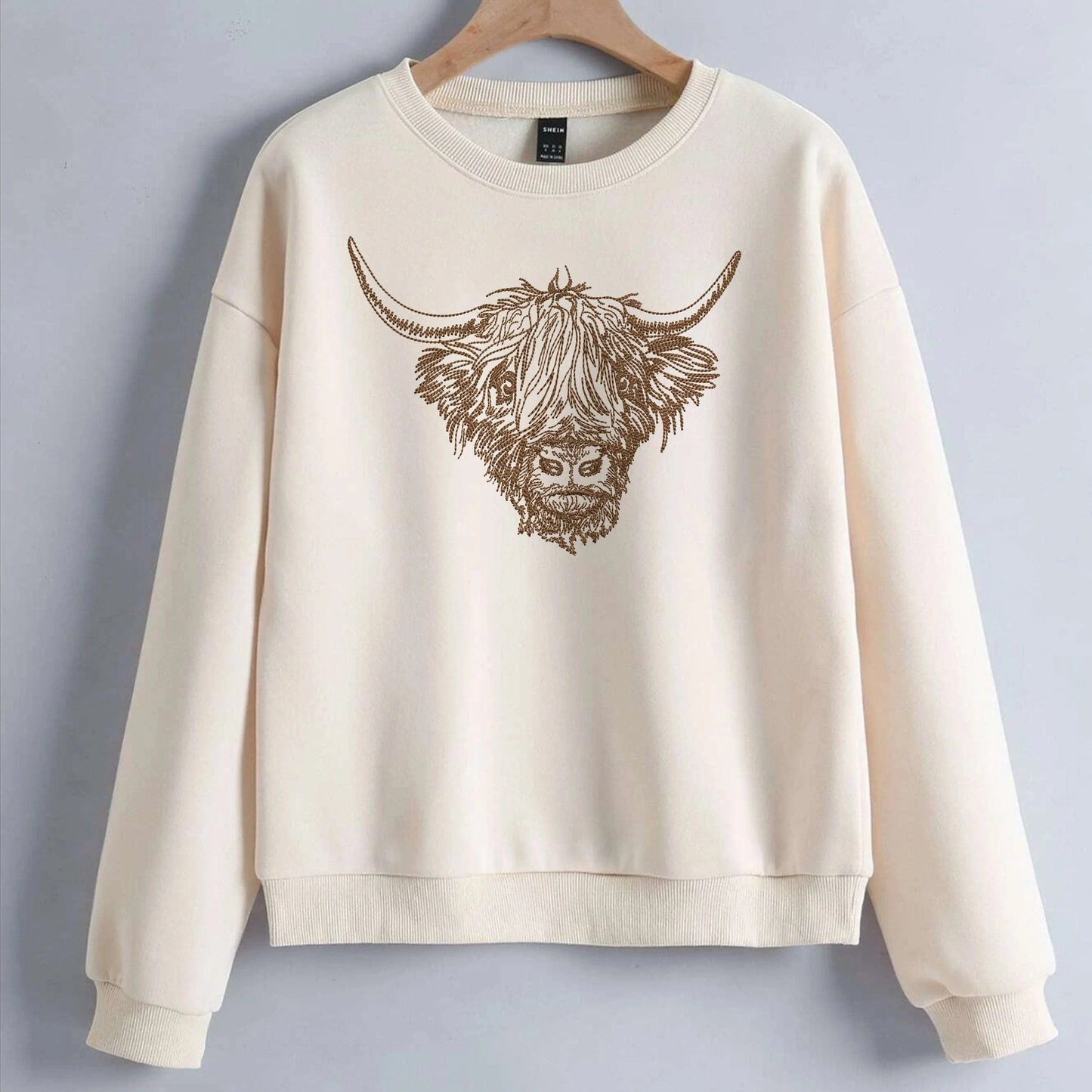 Scottish Cow Machine Embroidery Design on sweatshirt